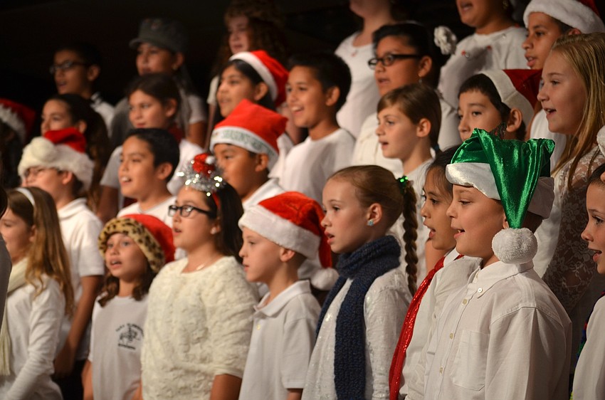 Fifth-grade students perform holiday-themed songs.