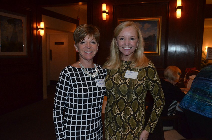 Patty Cooper and Phyllis Black wear Michael Kors to honor one of Longboat’s newest residents.