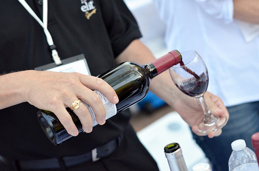 Guests sample wines at the Florida Winefest and Auction Banquet on the Block.