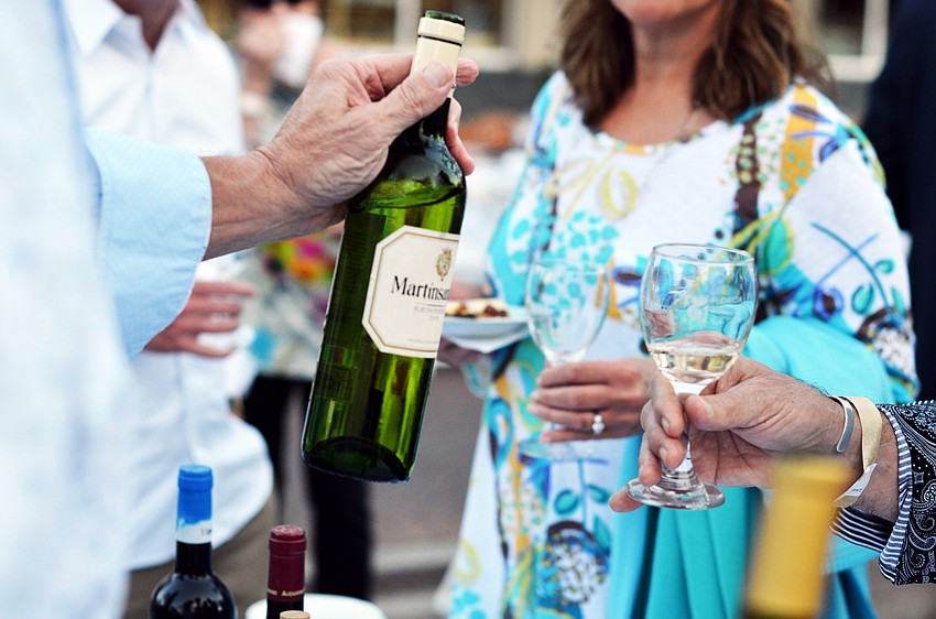 Guests sample wines at the Florida Winefest and Auction Banquet on the Block.