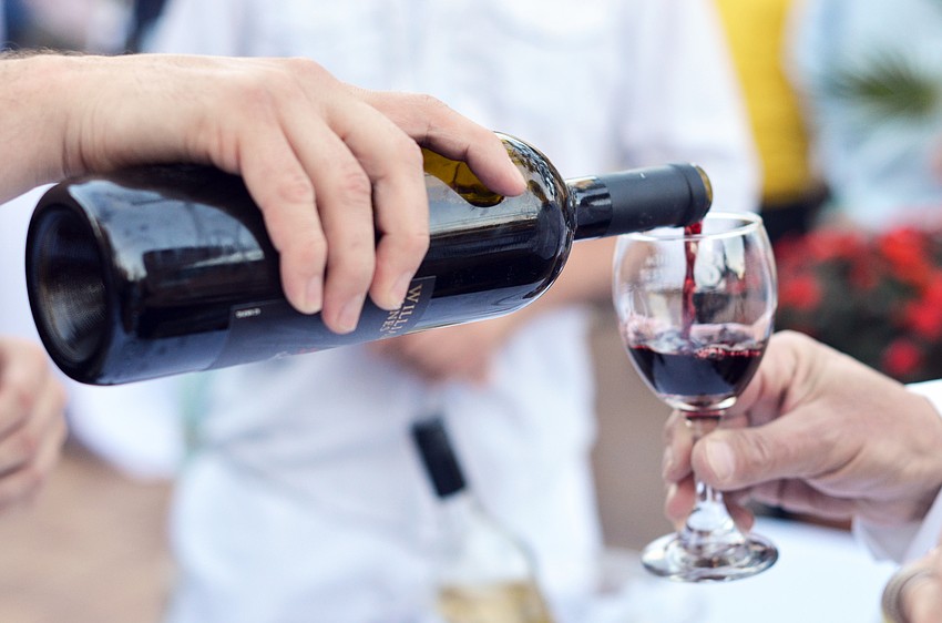 Guests sample wines at the Florida Winefest and Auction Banquet on the Block.