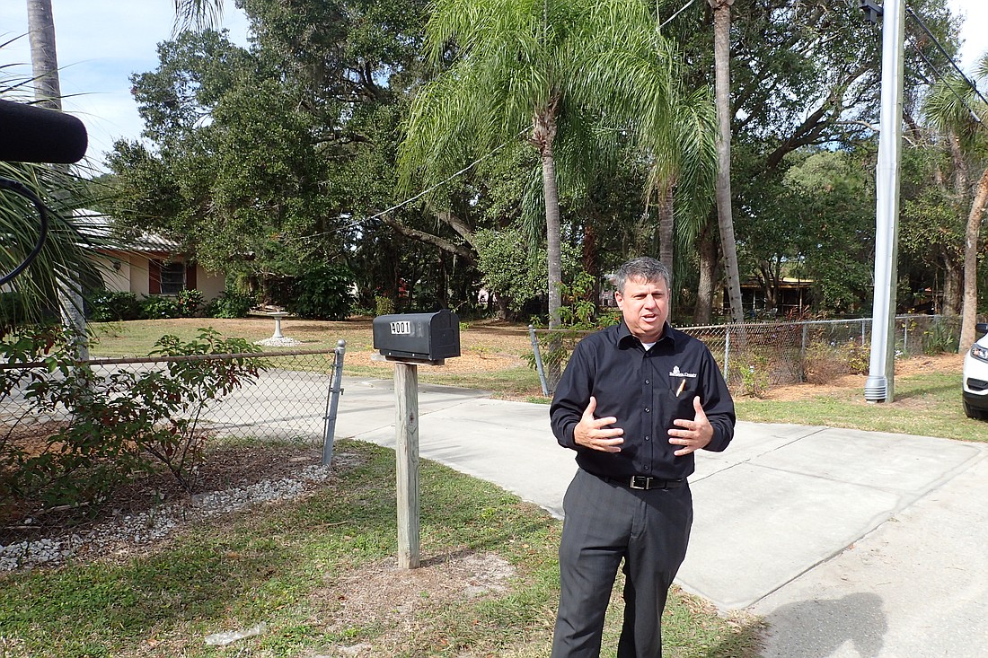 Sarasota County Homeless Services Director Wayne Applebee, in front of a private residence on Butler Avenue that the county identified as a potential shelter site.