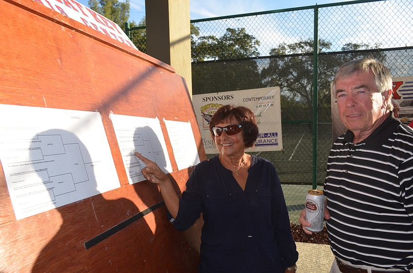 Christine and John Short check their team’s schedule and opponents.