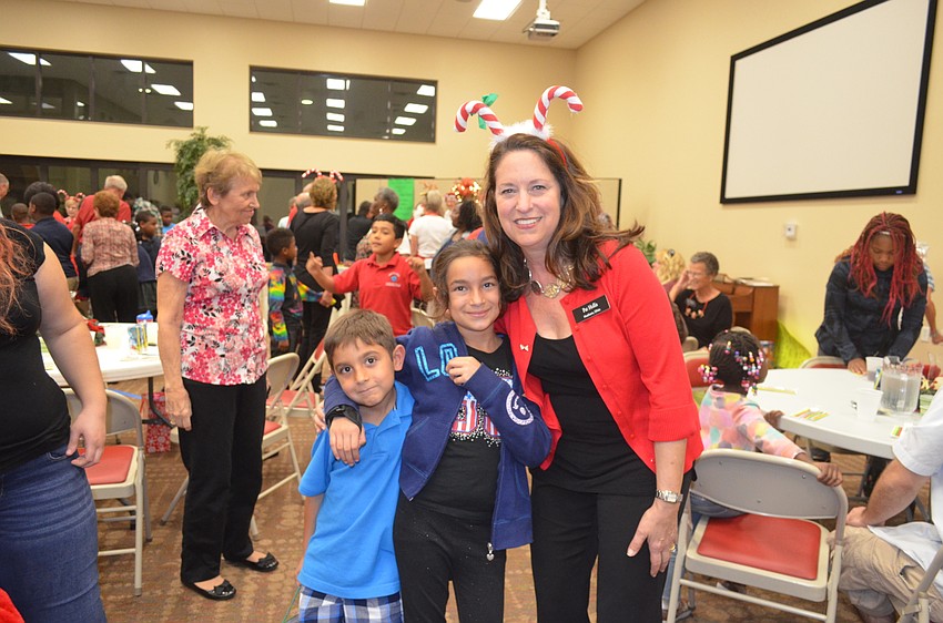 Alberto Fisher, 6, with sister, Elizabeth, 9, and Pat Hollis