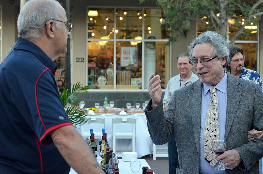 Vintners and guests discuss wine during the cocktail hour at the Florida Winefest and Auction Banquet on the Block.