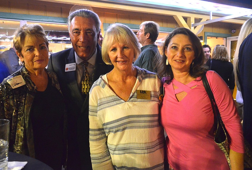 Pat Mock, of Design 2000, Andrew Vac, of Matusiak/Vac Real Estate Group, Peg Pluto, of Tommy Bahama, and Irina LaRose, of Design 2000