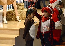 Amelia Villa Mosqueda and Chiara Diaz play Ralph the Reindeer and the Candy Cane Kid.