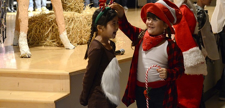 Amelia Villa Mosqueda and Chiara Diaz play Ralph the Reindeer and the Candy Cane Kid.