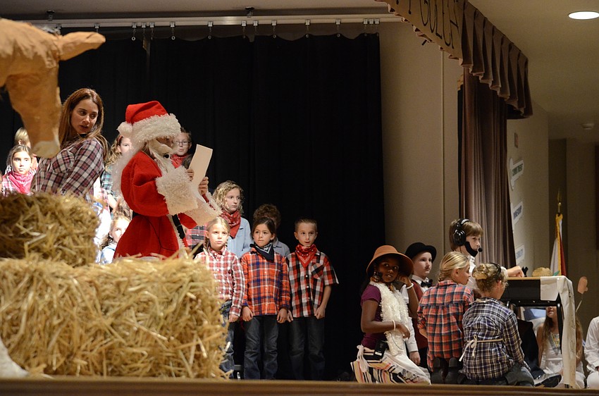 Annalisa Miller as Santa reads the plea for help from the OK Corral.