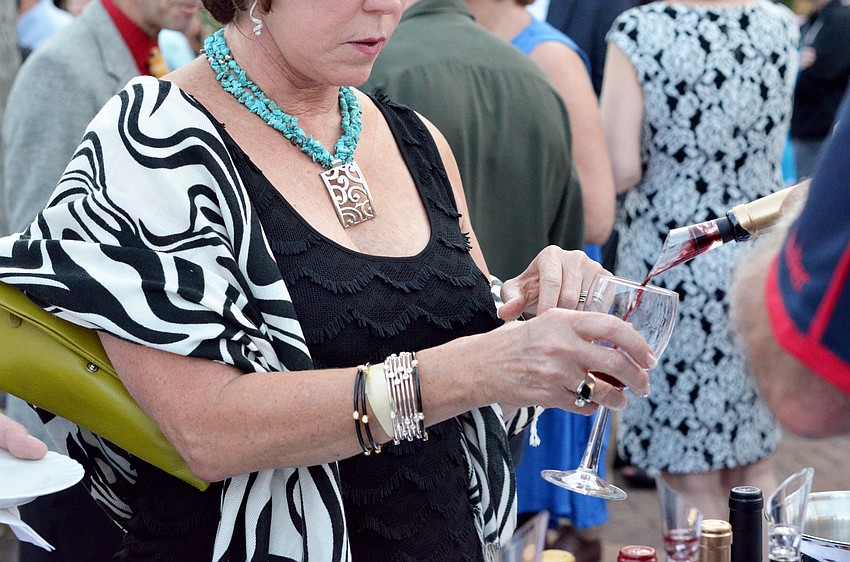 Guests sample wines at the Florida Winefest and Auction Banquet on the Block.