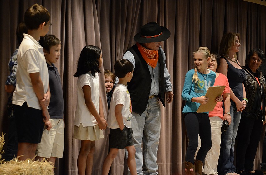 Art teacher Roy London played a warm up game where contestants tried to match classmates with family members on stage.