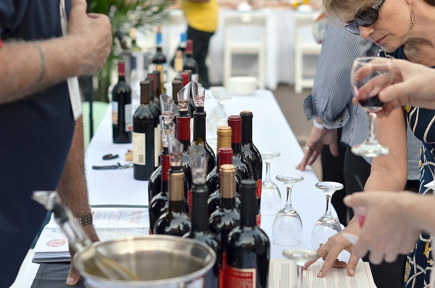 Guests sample a variety of wines before being seated for dinner at the Florida Winefest and Auction Banquet on the Block.