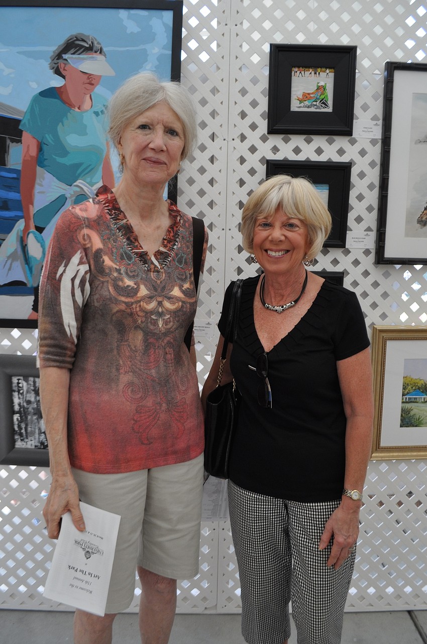 Corinne Strand and Anne Greene check out the art on display.