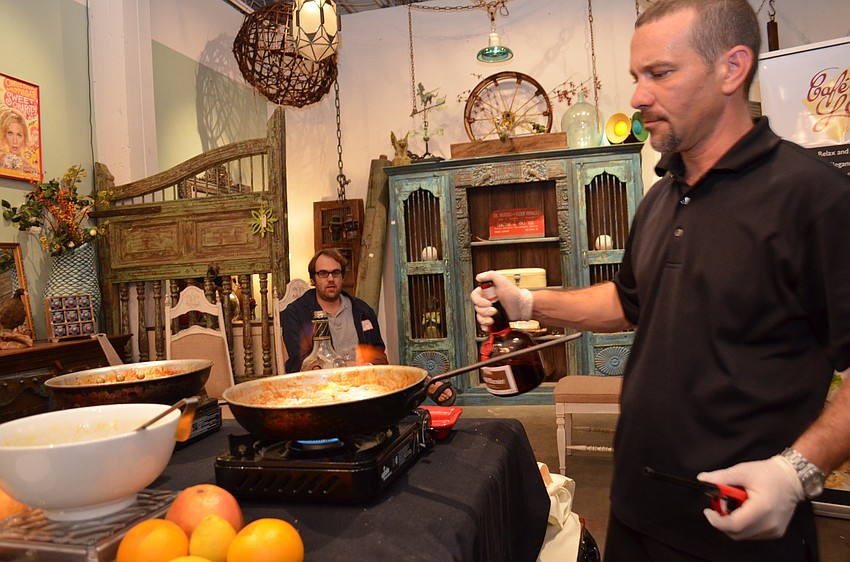 Rian DeLutz of Cafe L'Europe whips up crepe suzettes for guests.