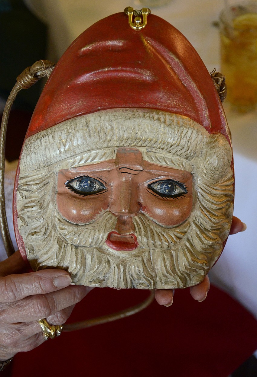 Beverly Allen also has a Timmy Woods hand-carved Santa clutch that she brings out for Christmas.