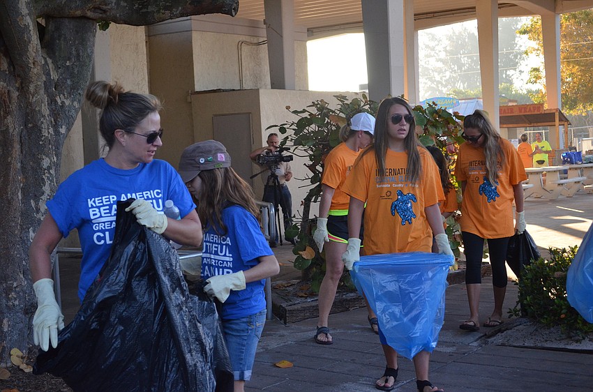 Volunteers start at the Siesta Beach pavilion with trash bags in hand.