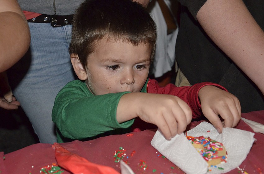 Carter Pratt of Sarasota finishes decorating a cookie.