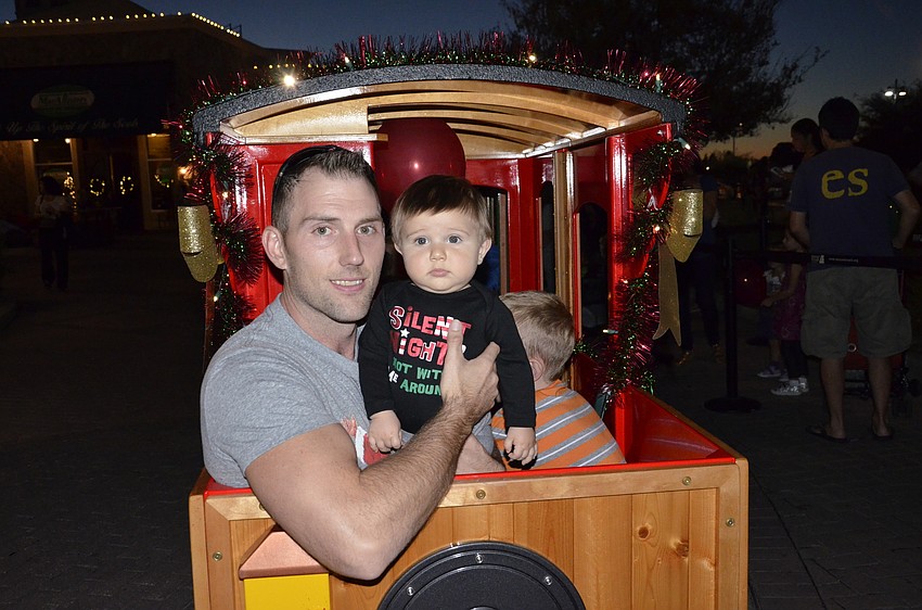 Sean and Brayden Gast of Lakewood Ranch get ready for a train ride around the circle.
