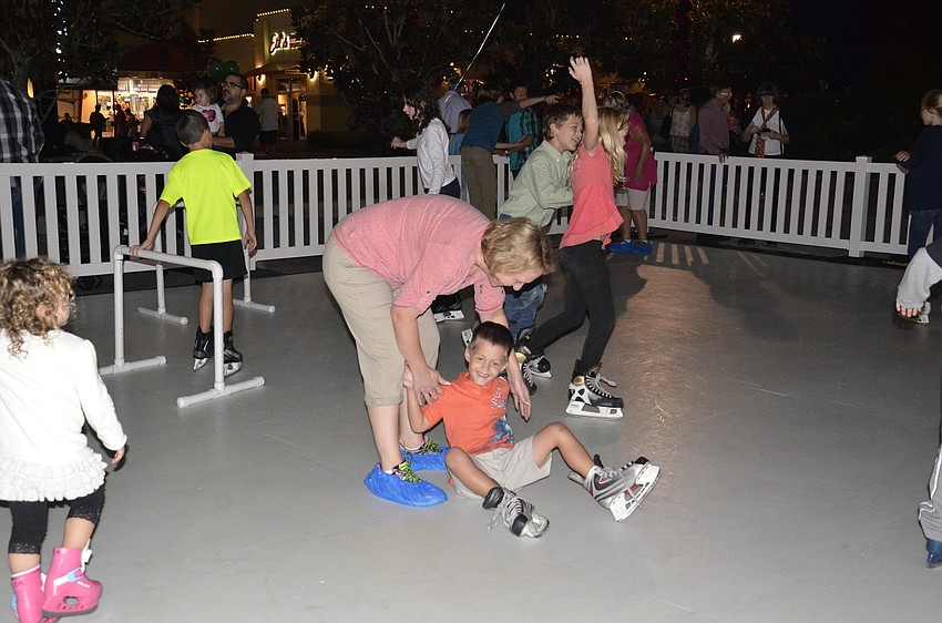 Sarasota resident Shelly Bishop helps up her son, Gabriel, as he navigates the perilous 