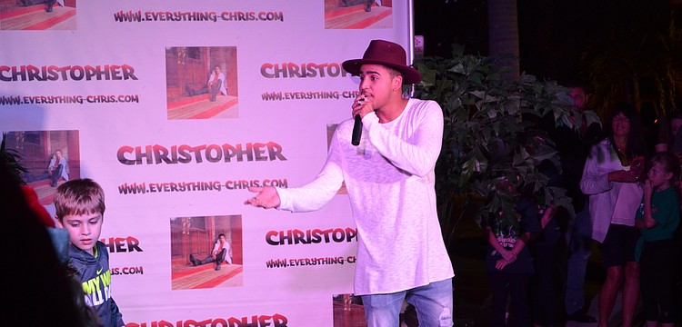 Artist Christopher Eisenberg performed on the stage for attendees.