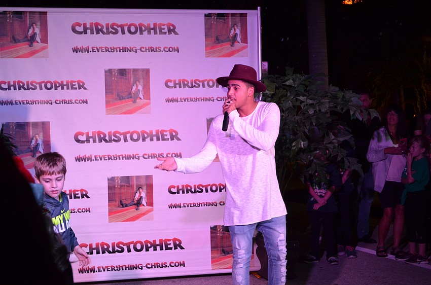 Artist Christopher Eisenberg performed on the stage for attendees.