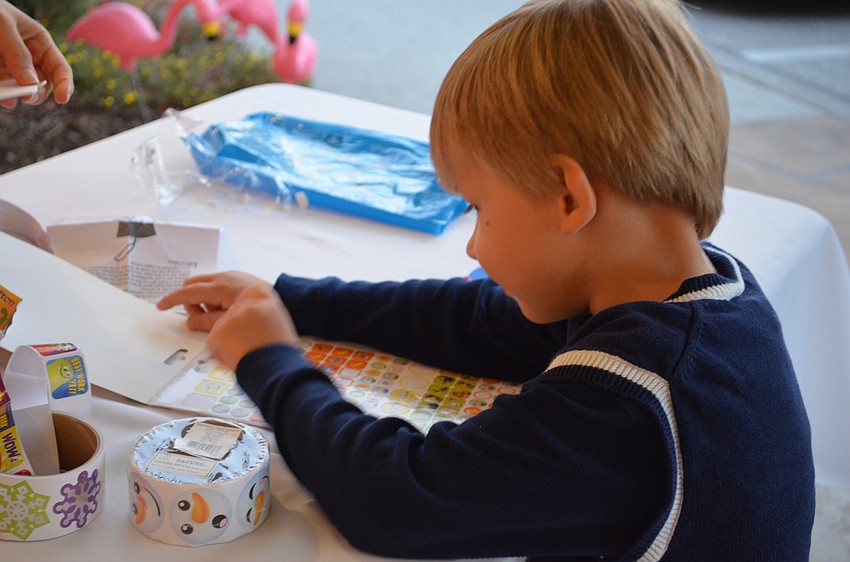 Sebastian Turk picks out stickers for his craft project.
