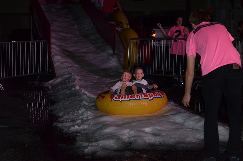 Weston Blomster and Jack Crowley pick up speed at the bottom of the ice slide.