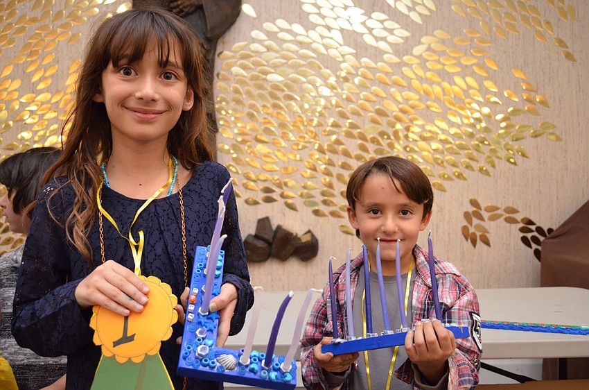 Lily and Luca Scholsberg won prizes for their menorahs.