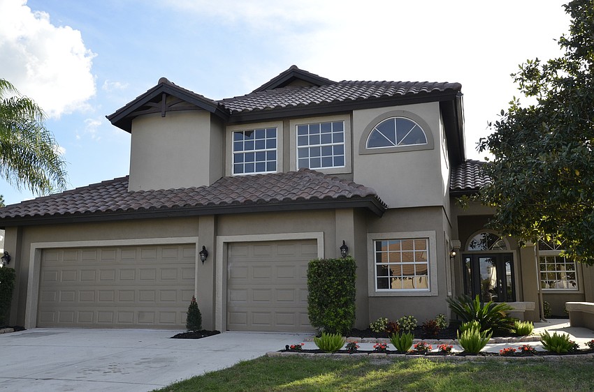 The home used to be a powder blue that neighbors would call the Smurf house, but Contarino had it repainted dark taupe.