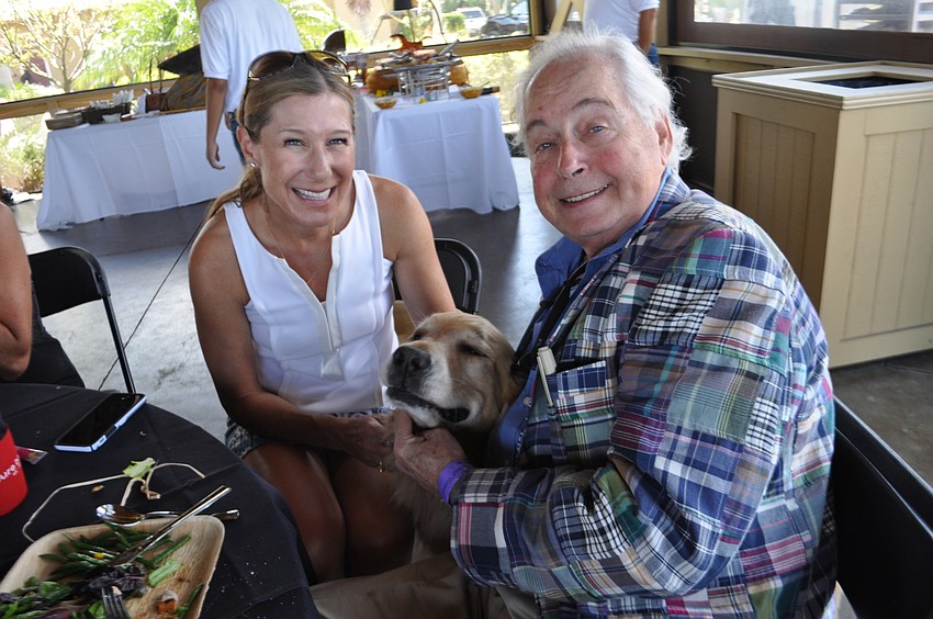 Janet Walten and Peter Barmonde, with Buck, enjoy lunch.