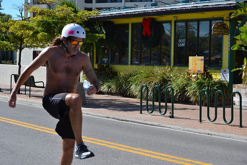 First place rider Jessie Howell gives a final push before crossing the finish line.