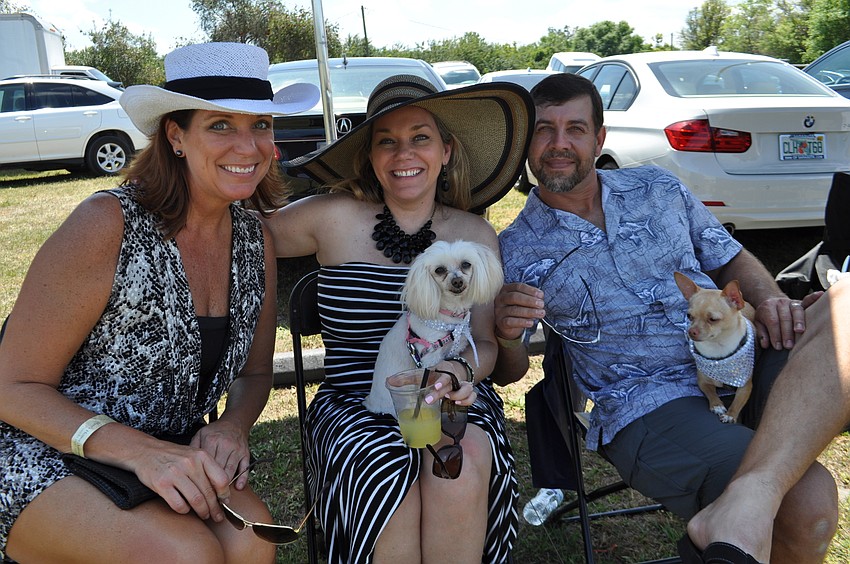 Jill Whisenant sits with Heather and Steve Fava and their dogs, Bella and Zoe.