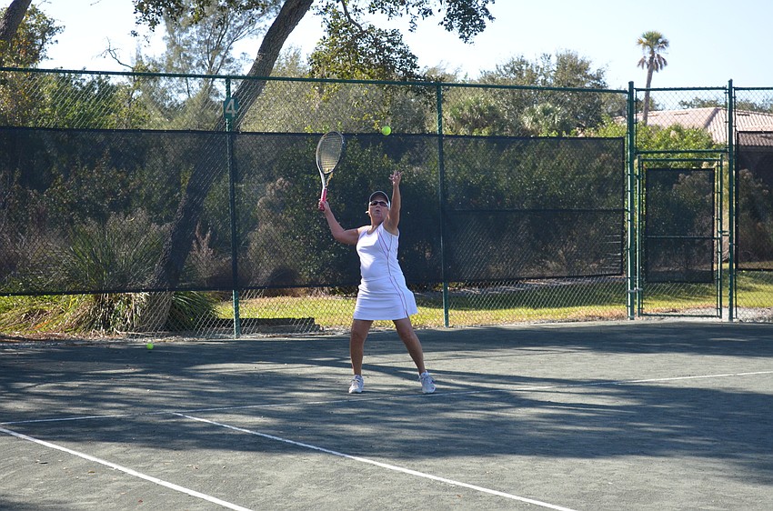 Cathy Powell serves.