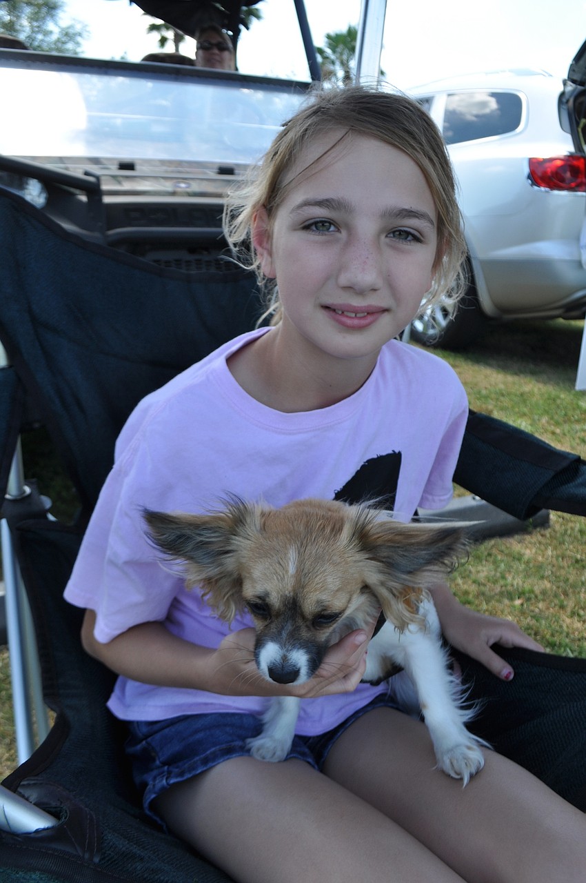 Hailey Redman holds her dog, Bella.