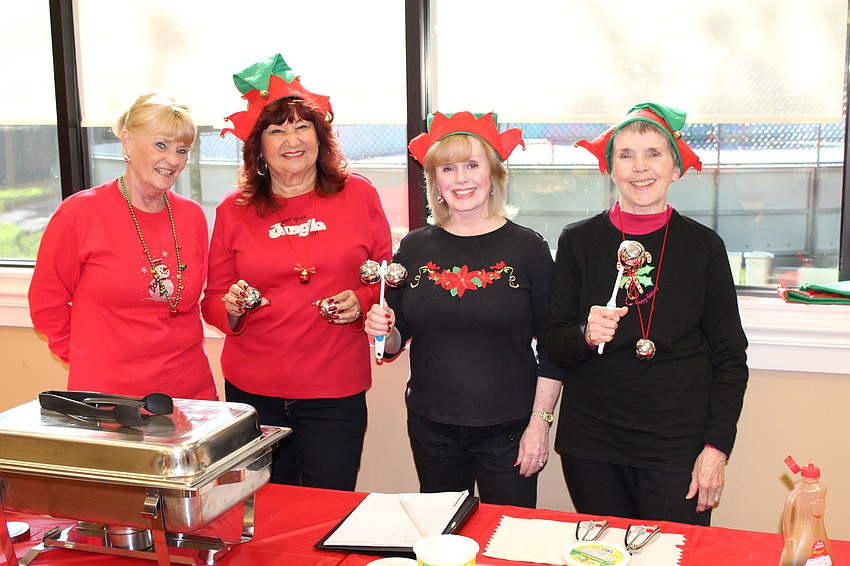 Sheila Boling, Marilyn Tropp, Sandy Anderson and Barb Aulenbach serve up pancakes and sausage.