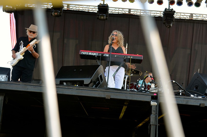 The Kat Crosby Band plays blues music for its audience.