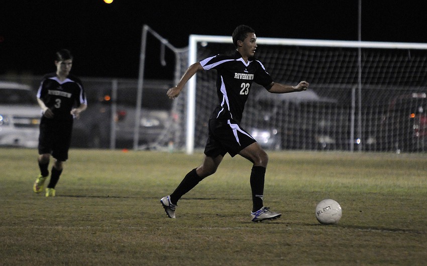 Riverview sophomore Ross Atkin maneuvers the ball across the field.