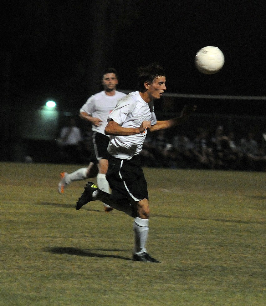 Sarasota's Bradley Gelb heads the ball in the first half.