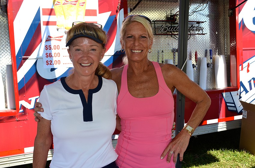 Nellie Gillander and Diana Brabeck serve up cold drinks to thirsty attendees.