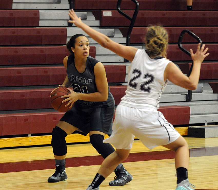 Lakewood Ranch junior guard Jordan Ward attempts to maneuver past Braden River's Taylor Ide.