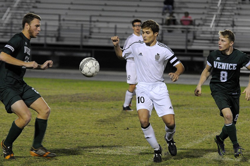 Braden River senior Domenic Aluise battles for the ball in the first half.