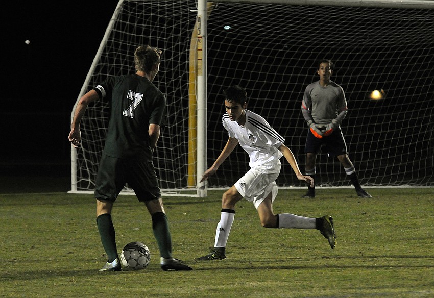Braden River's Nicholas Anderson helps defend the goal in the first half.