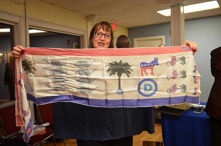 Democractic Club of Sarasota President Mary Clupper shows off her Florida democrat scarf.