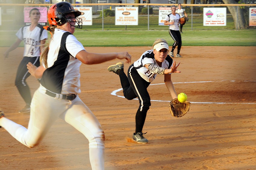Braden River third baseman Linda Ross tosses the ball back to home plate to save a run in the Class 7A-District 10 championship April 16.