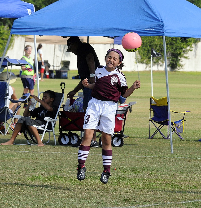 Braden River Rage U9 midfielder Madison McAvoy goes up for a header during the opening game of the Bradenton Cup April 18.