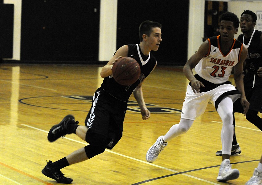 Braden River's Curtis Cobb drives to the hoop in the first quarter.