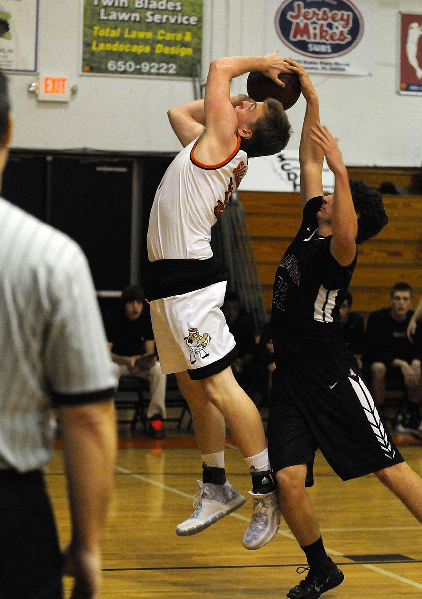 Braden River's Tyler Dyson gets a hand on Sarasota's Zach Rowden's shot.