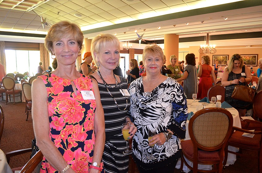 Leslie Tilton, Nancy Christian and Cindy Daughtrey chat with old friends and make new ones at the event.