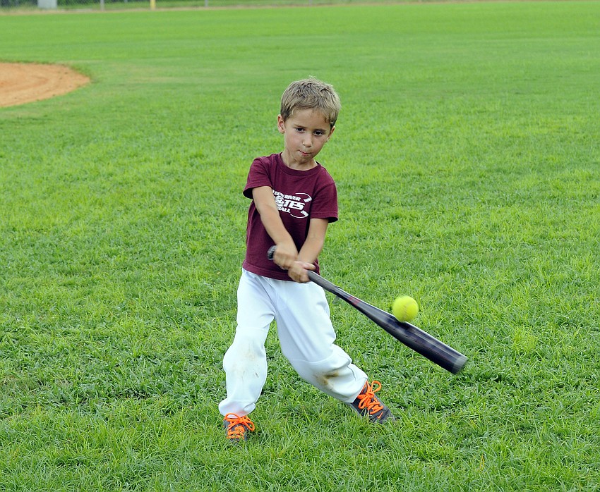Four-year-old Lane Spivey makes contact during Braden River’s baseball camp July 13 through July 16.