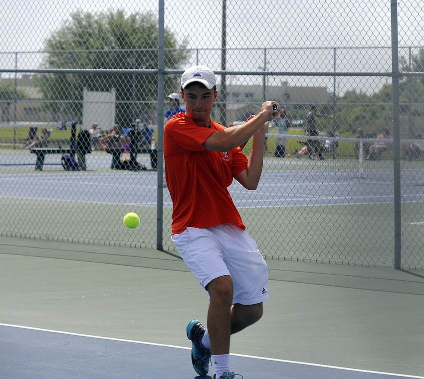 Sarasota senior Andre Johnson returns a serve during his No. 1 singles match March 24 to help lead the Sailors to the Class 3A-District 10 championship.